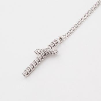 Brilliant-cut diamond cross pendant.