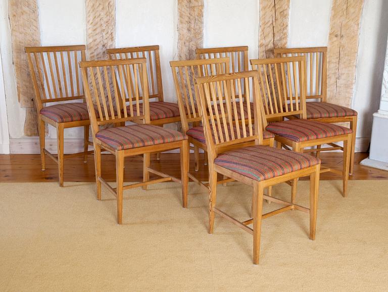 A SET OF EIGHT PINE CHAIRS,