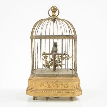 A music box in the shape of a bird's cage, France, late 19th century.