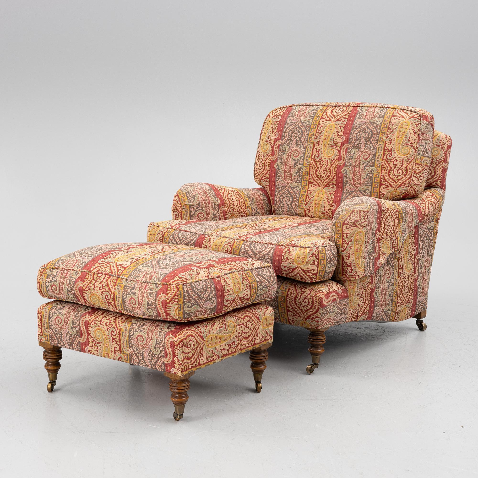A Howard armchair with ottoman.