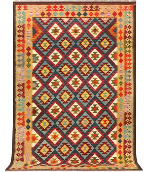 An Afghan Kelim carpet, c. 304 x 200 cm.