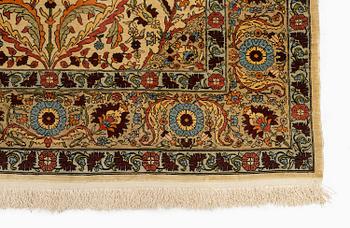 A semi-antique silk Hereke rug, c. 155 x 103 cm.