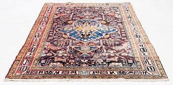 An oriental rug, c. 300 x 155 cm.