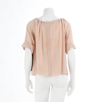PRADA, a powder pink blouse with black ribbon. Size 40.