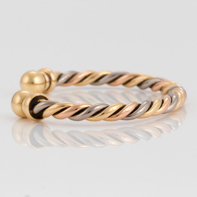 A Gaudy bangle in 18K tri color gold.