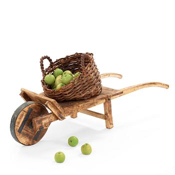 Ingrid Herrlin, a stoneware basket with 30 apples and a wheelbarrow, Sweden ca 1988.