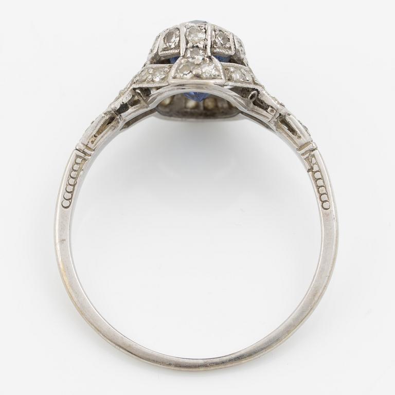 Ring 14K gold with a synthetic blue stone and small diamonds and white stones.