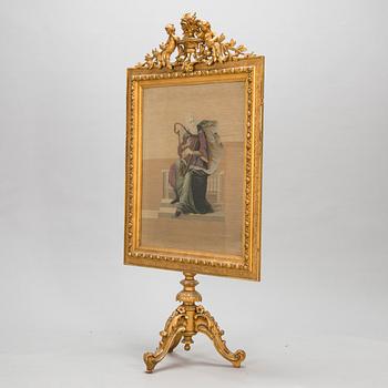 A late 19th century fire screen.