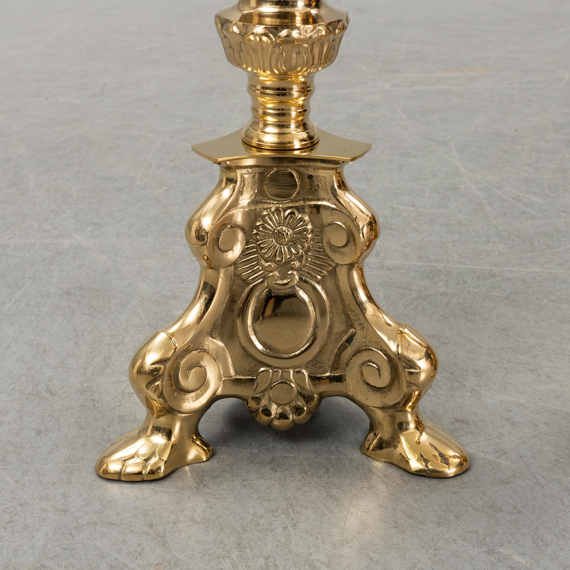 A pair of late 20th century or early 21th century brass altar candlesticks.