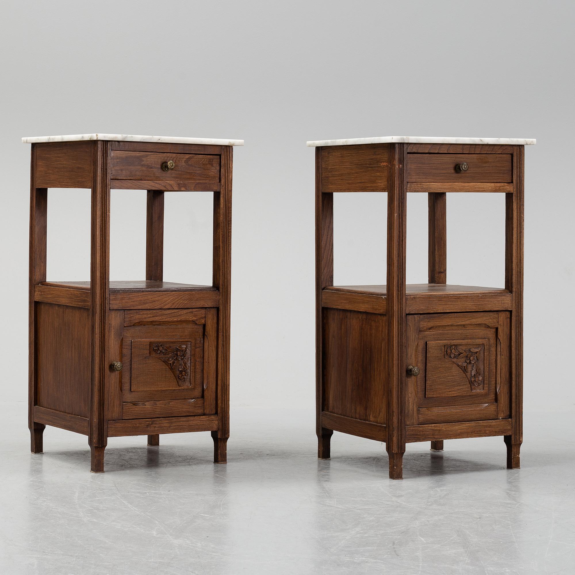 A pair of early 20th Century bedside tables.