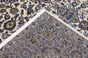 A Keshan carpet, signed, 386 x 281 cm.