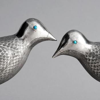 A pair of persian silver pigeons, the Qajar dynasty (1789–1925).