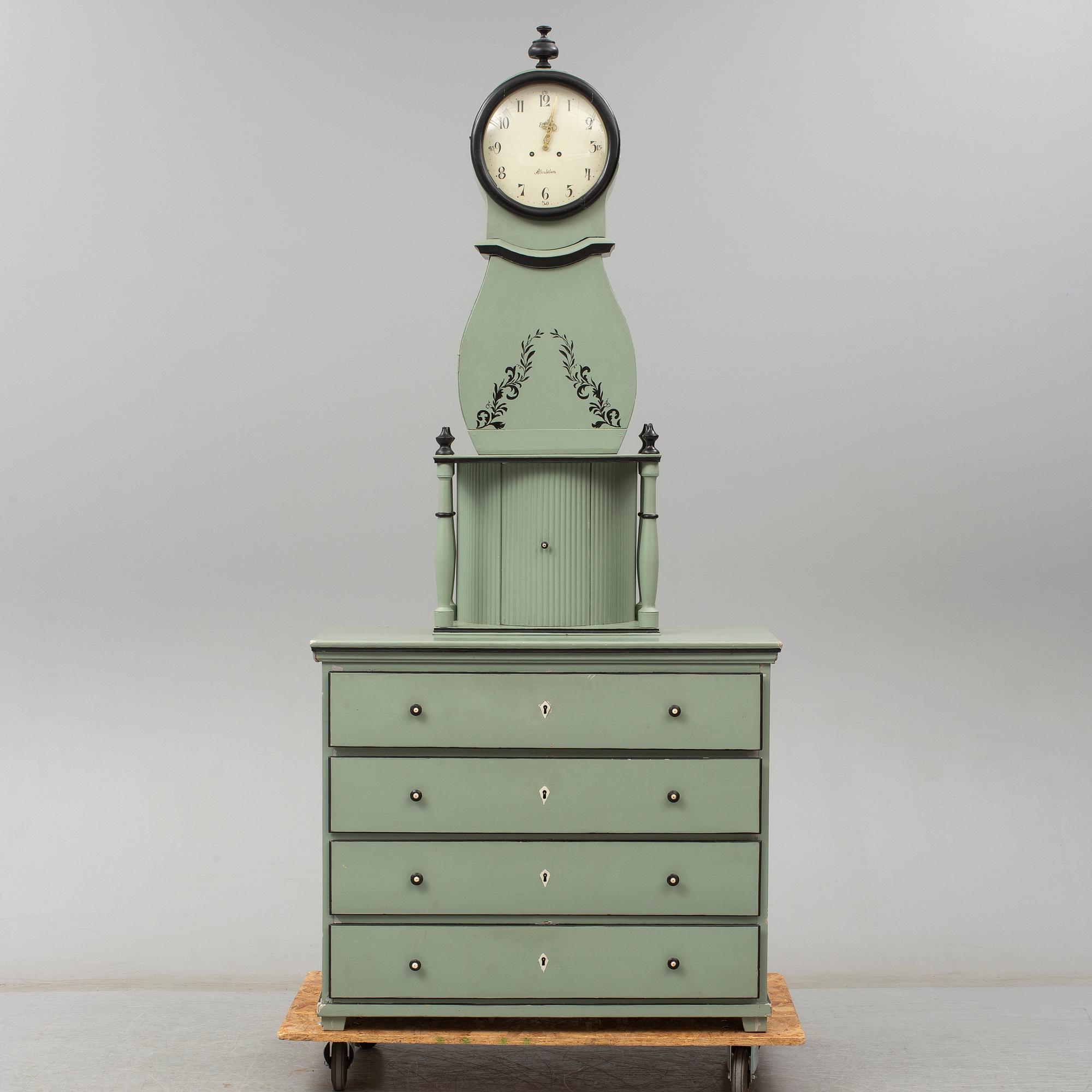 A combined clock and chest of drawers from late 19th  century.