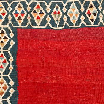 An antique Qashqai kilim rug, approximately 240 x 155 cm.