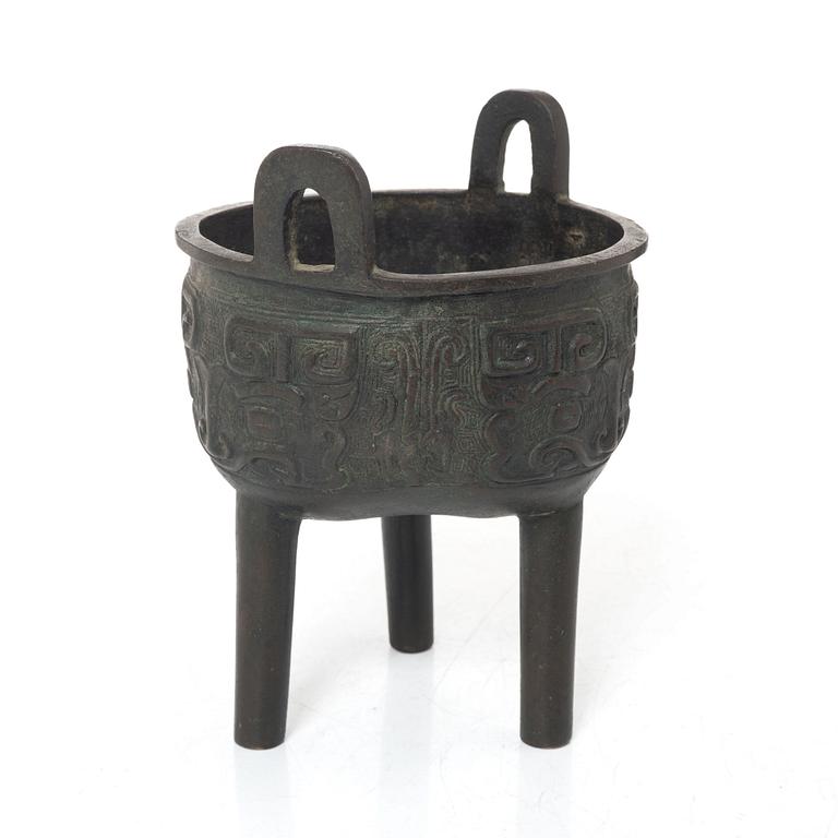 A Chinese tripod bronze censer, Ming style, Qing dynasty (1644-1912).