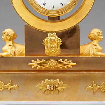 A late Gustavian early 19th century gilt bronze mantel clock.