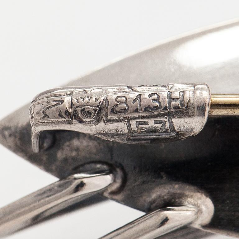 Elis Kauppi, Two silver brooches, one with a tiger's eye. Kupittaan kulta, Turku 1959 and 1962.