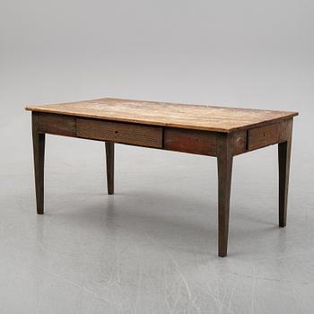 A 19th Century table with drawers.