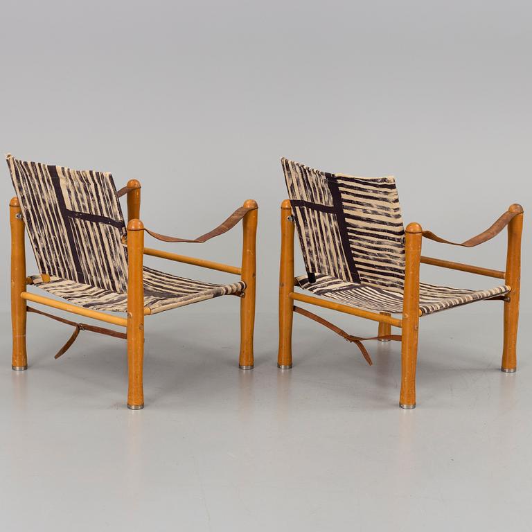 A pair of mid 20th century safari easychairs.