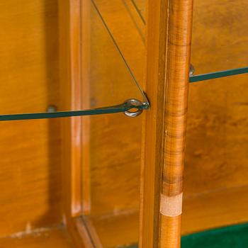 A 1940s display cabinet, England.