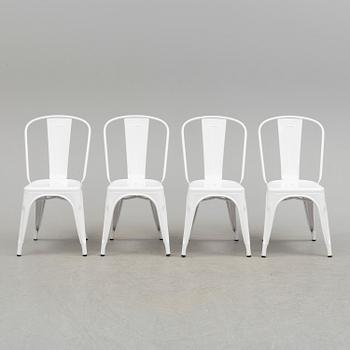 A set of four Tolix chairs.