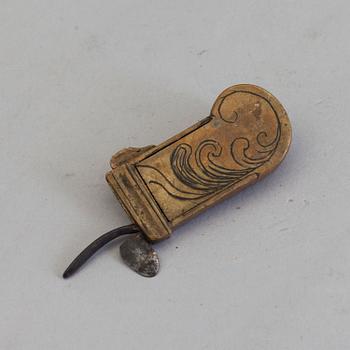 A brass and iron phleam dated 19th century.