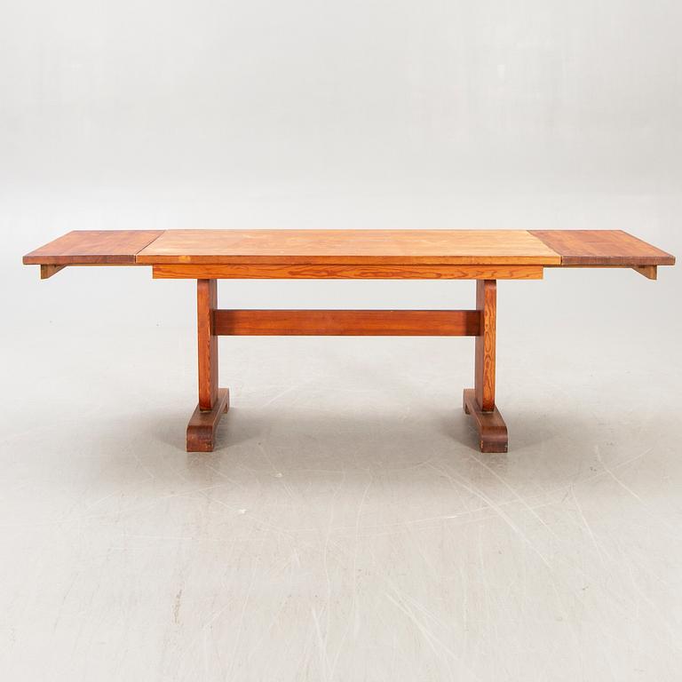 A 1940s pine dining table.