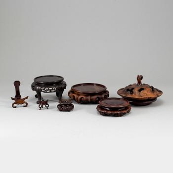 A group of six wooden stands and two covers, China, 19th/20th Century.