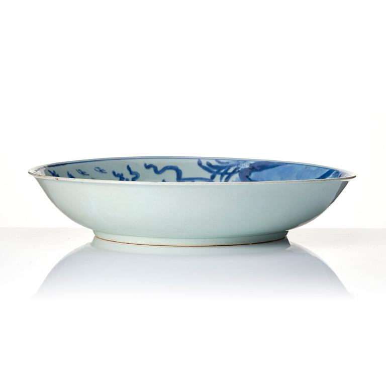 A blue and white 'phoenix and peony' dish, Qing dynasty, Kangxi (1662-1722).