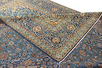 A Kashan carpet, signed Isfahanian, a. 407 x 310 cm.