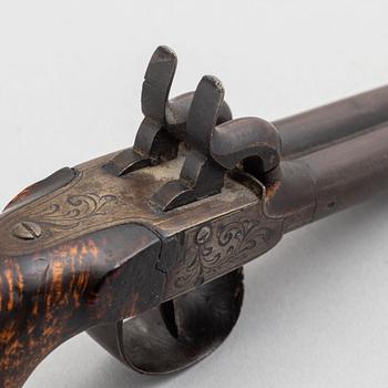 Two 19th century percussion pistols.