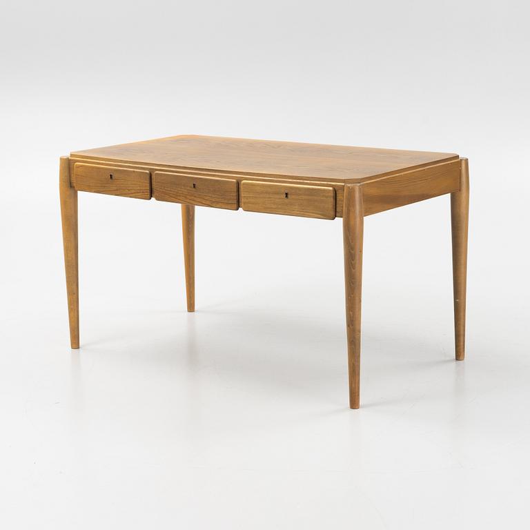 An elm desk, mid 20th Century.