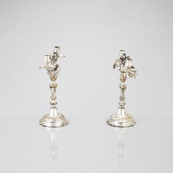 A pair of Swedish Rococo argent haché candelabra.