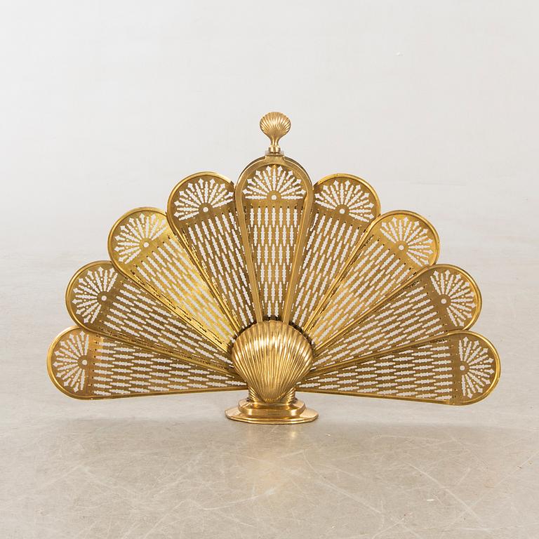 A brass fire screen later part of the 20th century.