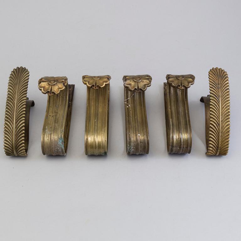 SIX BRONZE CURTAIN TIE-BACKS (4+2), 19th century.