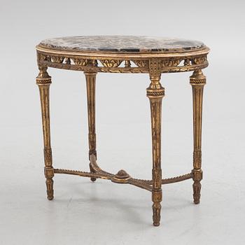 A Louis XVI-style table, circa 1900.