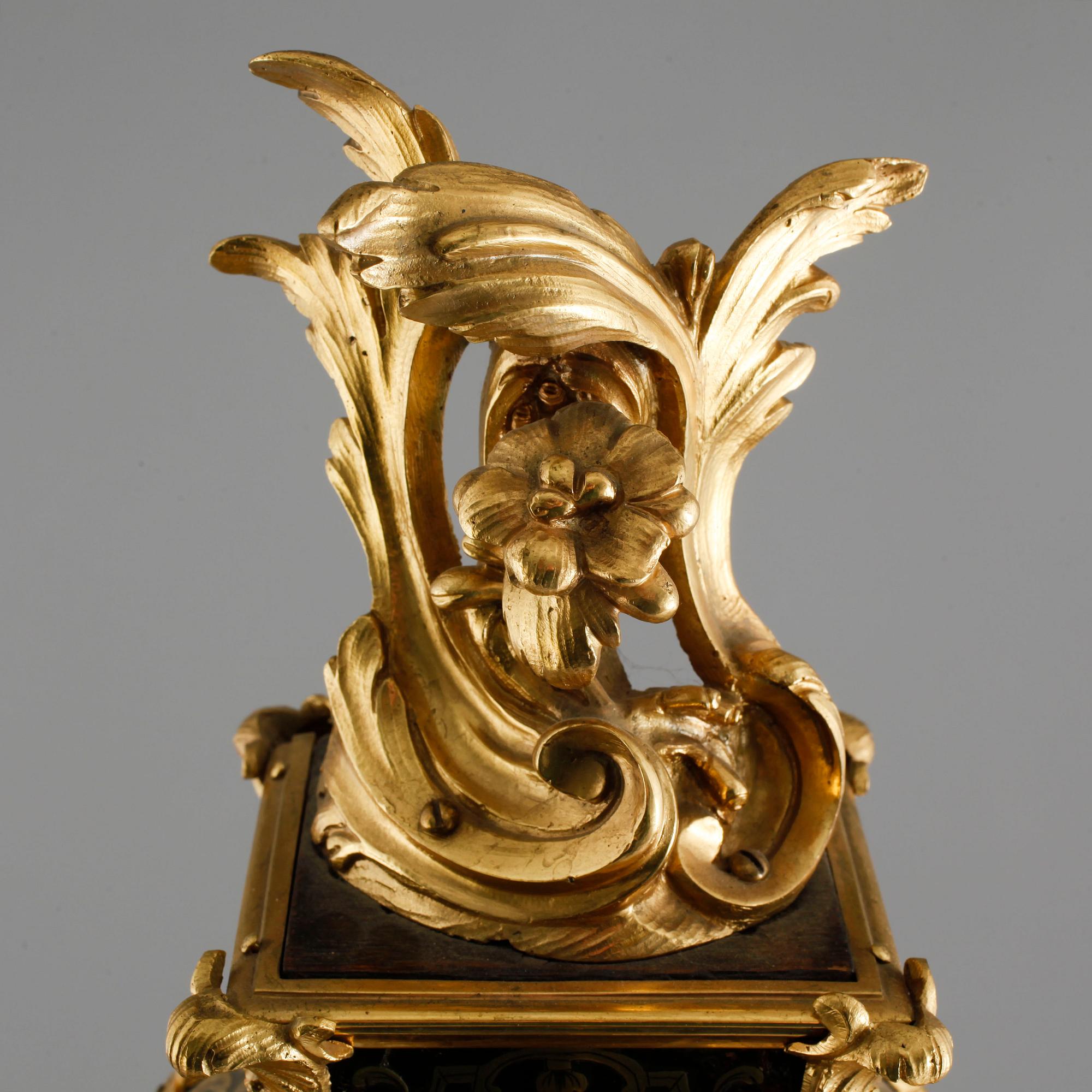 A 19th century mantle clock in the style of Louis XV.