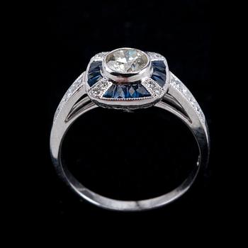 A RING, brilliant cut diamonds 1 x 0.51 ct. and 0.36 ct. Fancy cut sapphires.