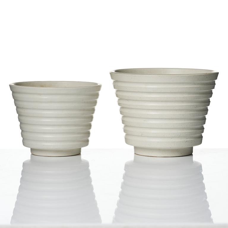 Wilhelm Kåge, A set of three ceramic flower pots, a vase and jar with lid,  Gustavsberg 1930s.