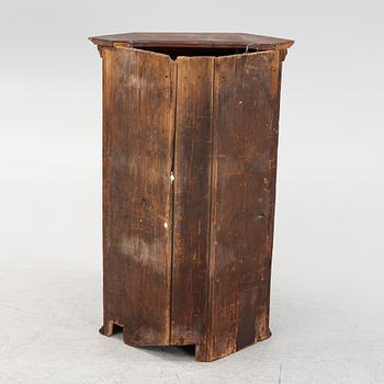 A corner cabinet, 18th Century.