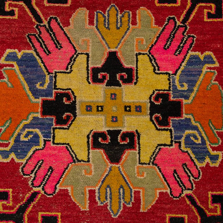A RUG, an old Khotan probably, ca 151,5-153 x 83-85,5 cm.