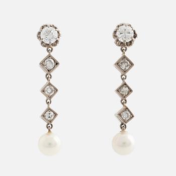 A pair of 18K gold earrings with cultured pearls and round- and eight-cut diamonds.