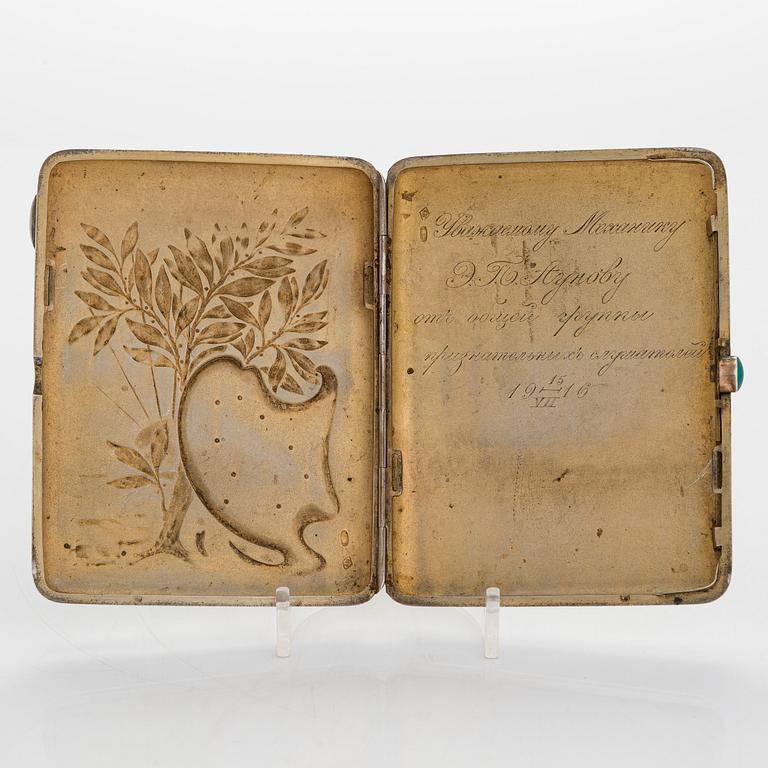 A silver cigarette case, Moscow, dated 1916.