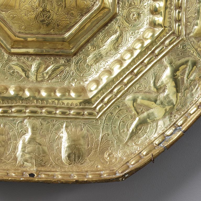 A Baroque presumably Dutch/Flemish brass reflector plate, mid 17th century.