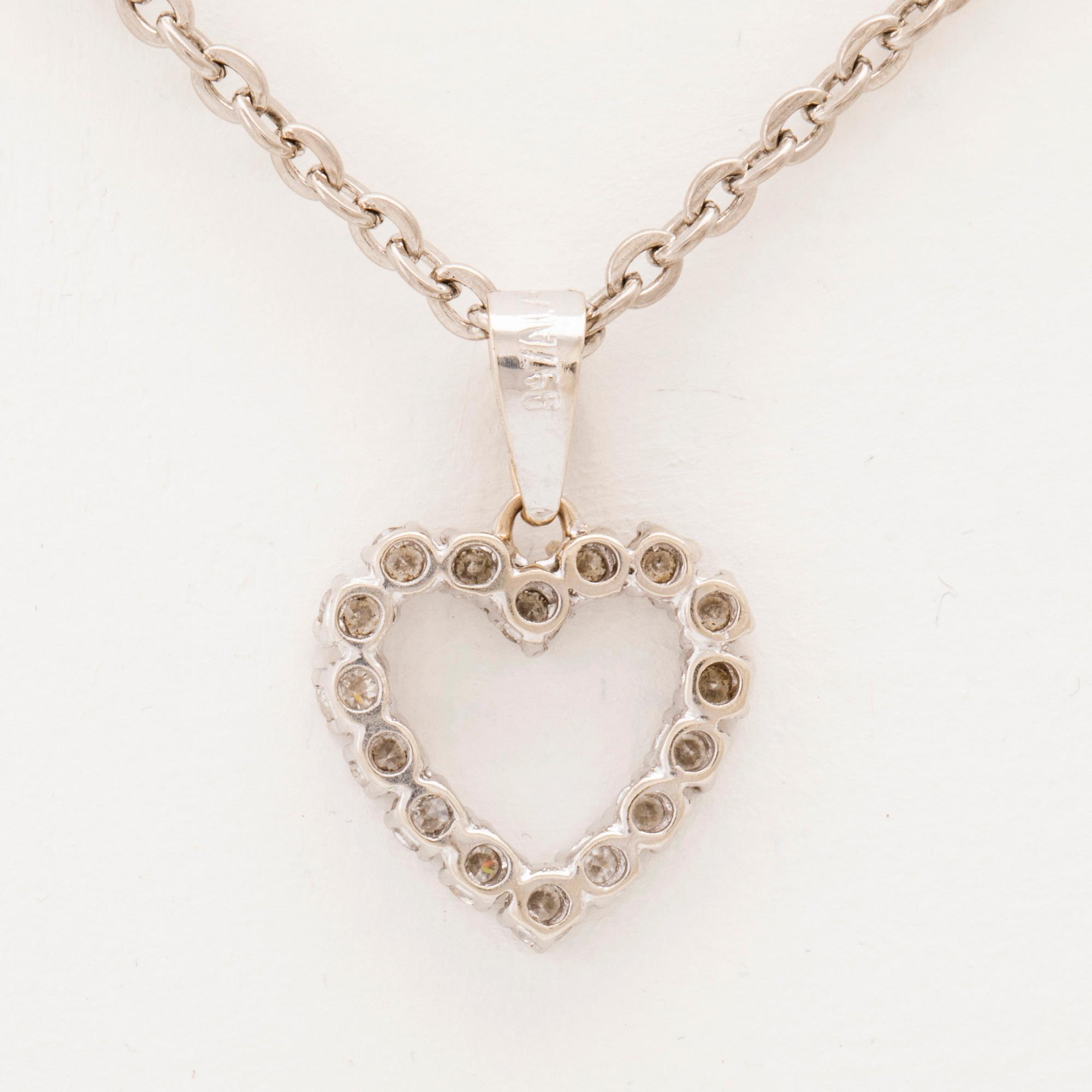 An 18K white gold pendant set with round brilliant cut diamonds.