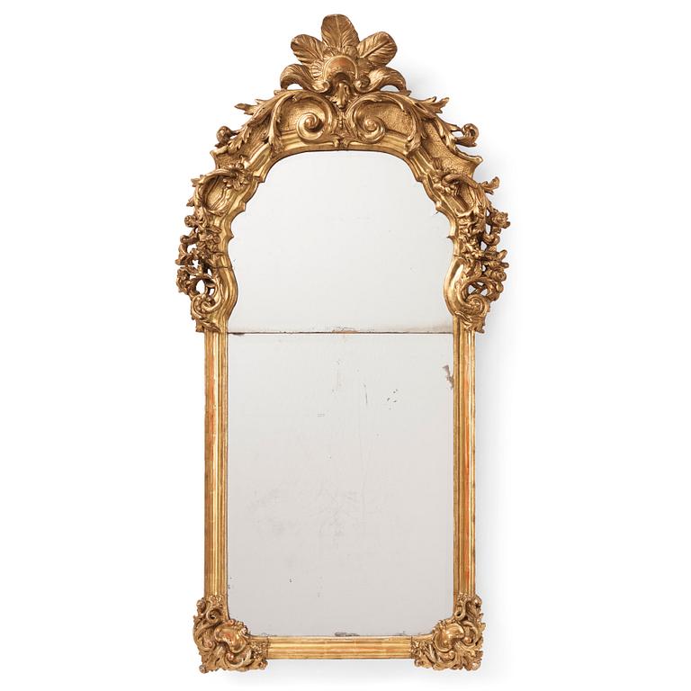 A presumably German giltwood rococo mirror, mid 18th century.