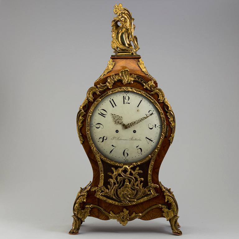 A Rococo/Rococo-style 18th/19th century mantel clock.