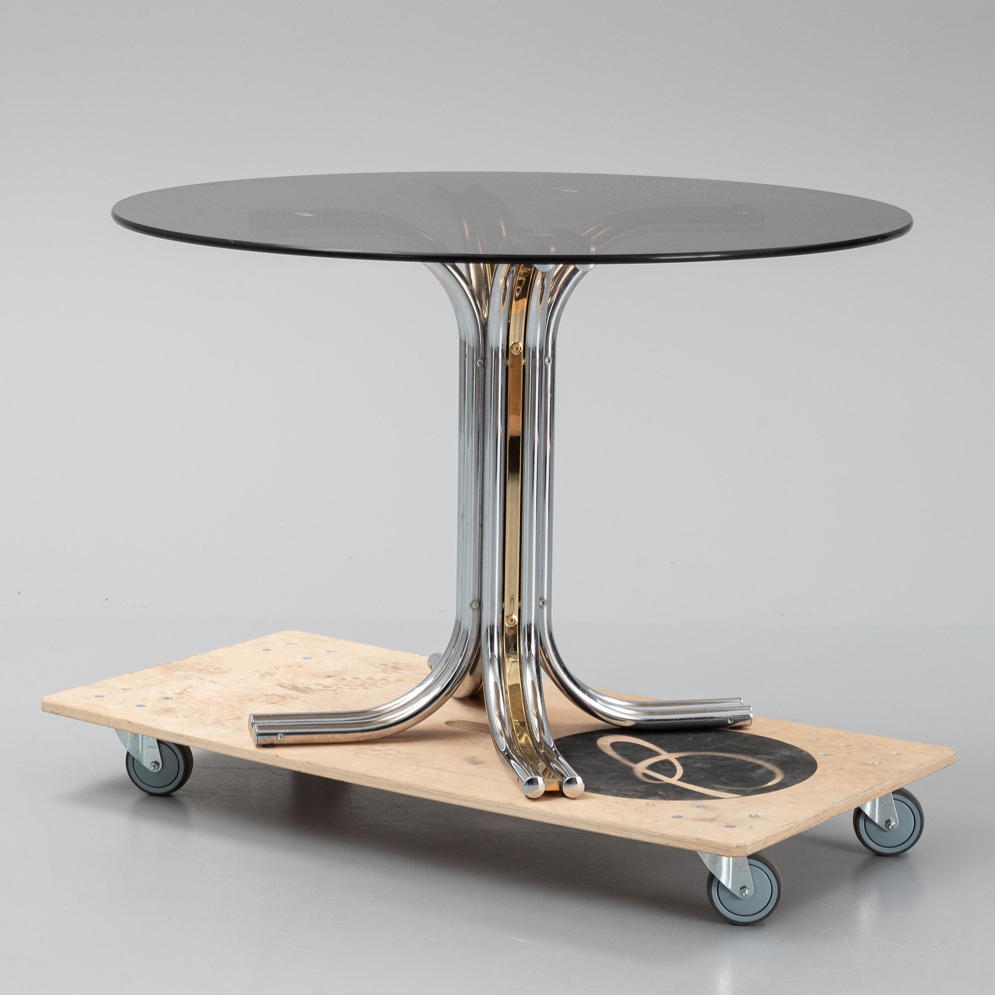 An iIalian glass top dining table, 1970's/80's.