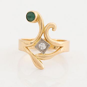 18K gold brilliant cut diamond and  cabochon cut emerald ring.