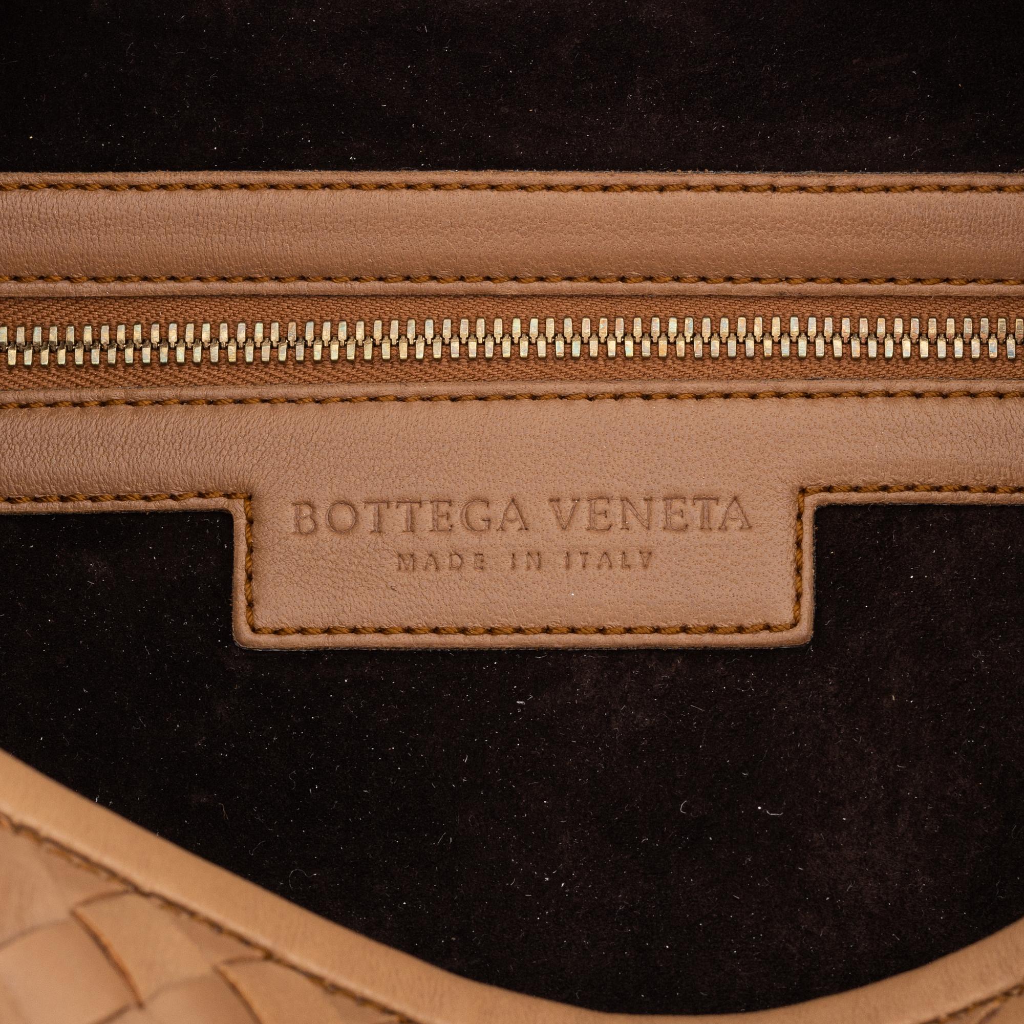 Bottega Veneta, a beige intrecciato leather bag.